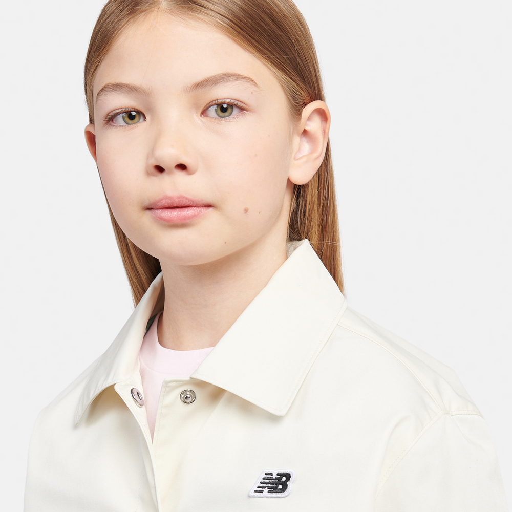 Kurtka dziecięca New Balance LAKG0095LIN – beżowa