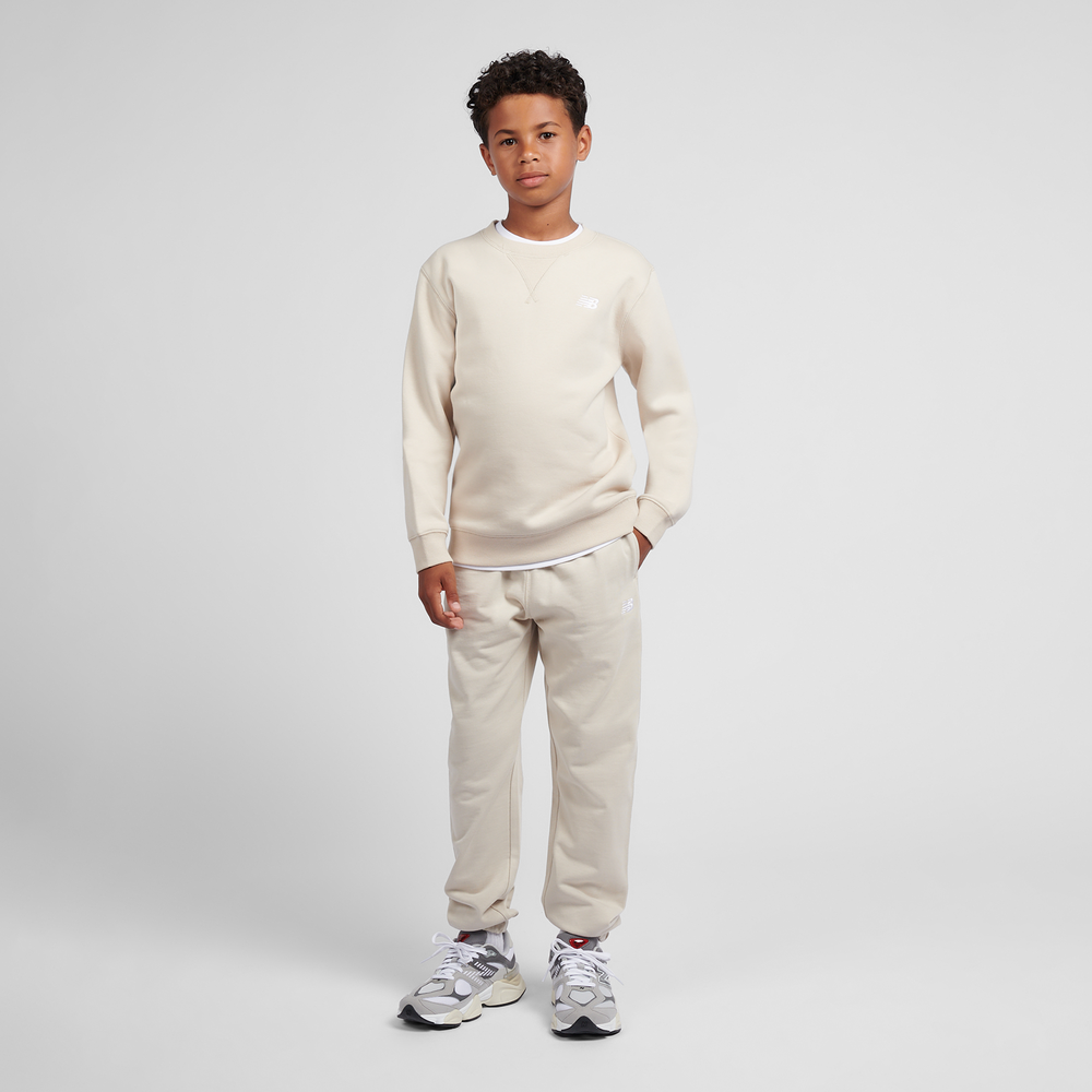 Spodnie dziecięce New Balance LAKB0060TWF – beżowe