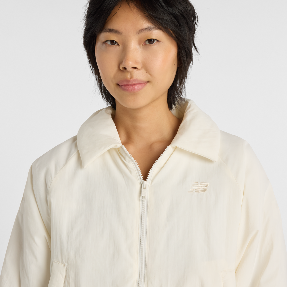 Kurtka damska New Balance WJ61D8YXSST​ – beżowa