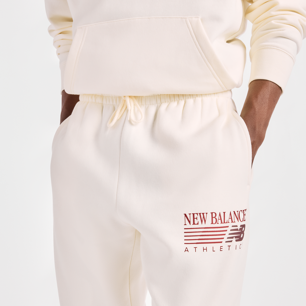 Spodnie męskie New Balance Reimagined Graphic – beżowe