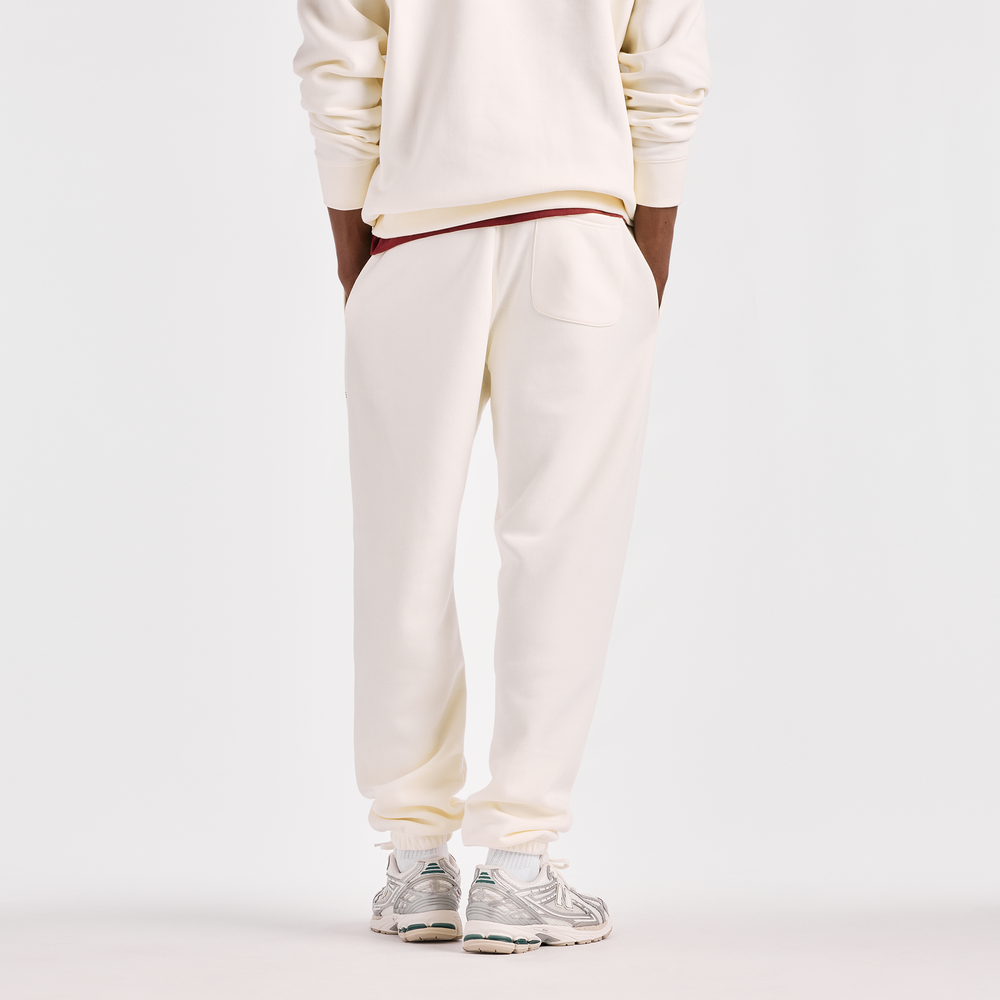 Spodnie męskie New Balance Reimagined Graphic – beżowe
