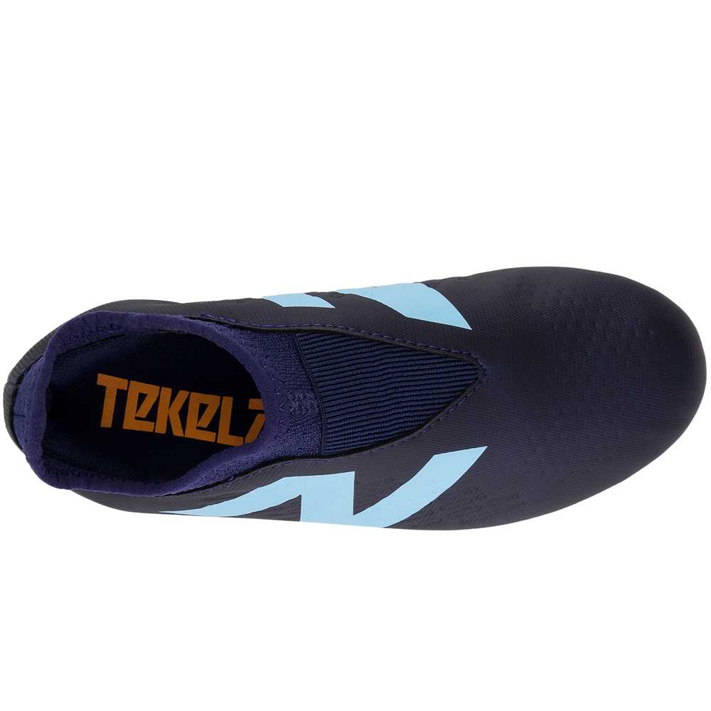 Korki dziecięce New Balance TEKELA V4+ MAGIQUEJNR FG SJT3FN45 – granatowe