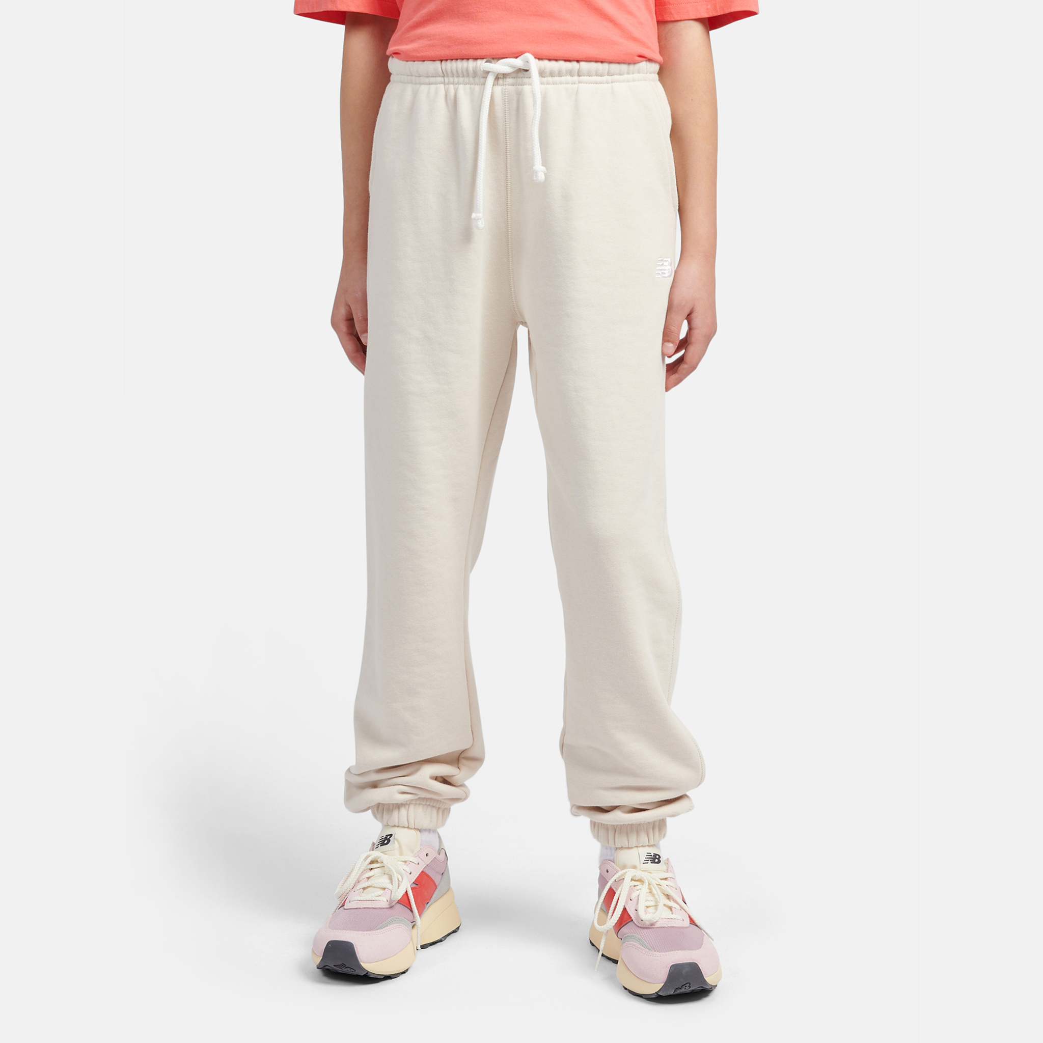 Spodnie dziecięce New Balance LAKG0058LIN – beżowe