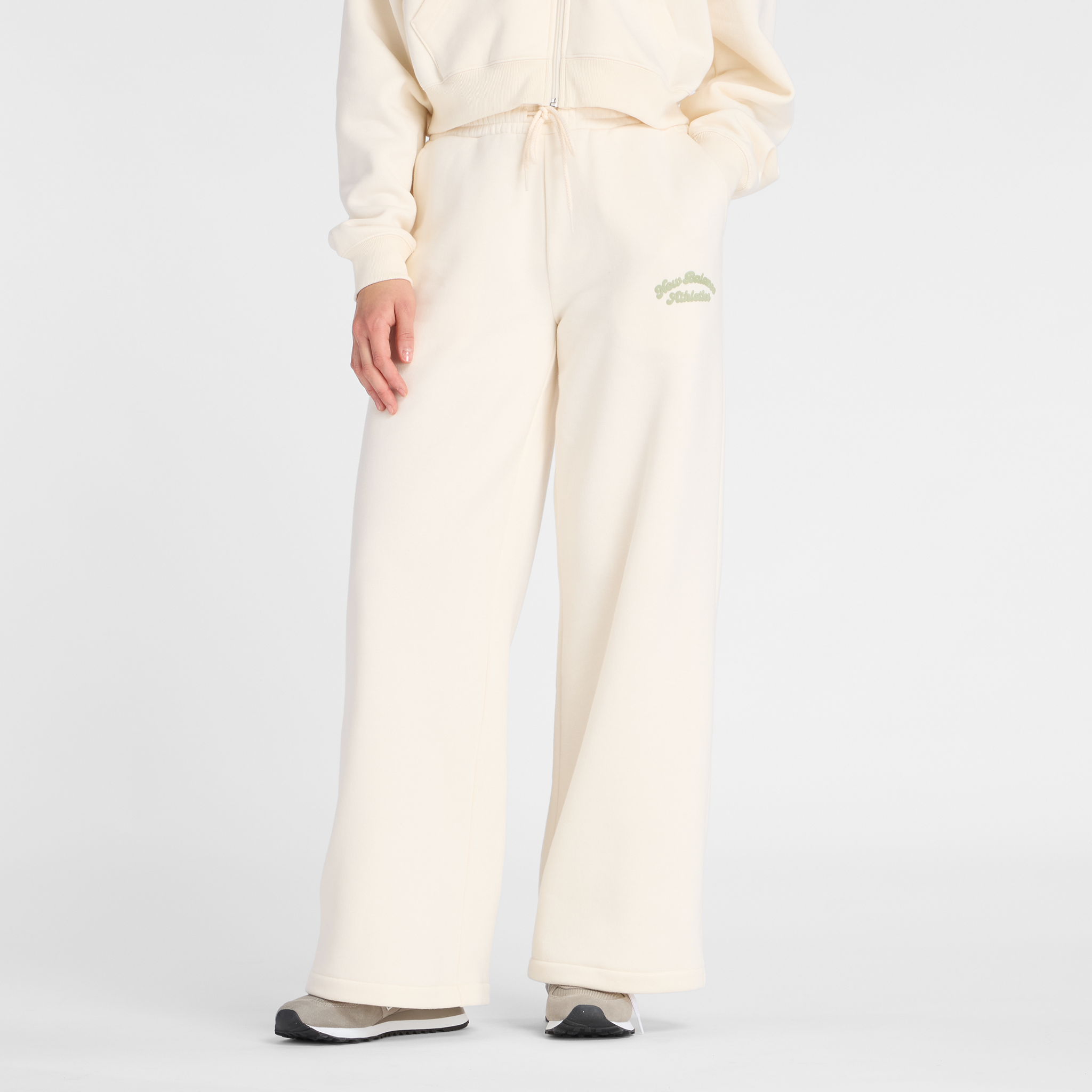 Spodnie damskie New Balance WP53902PEF – beżowe