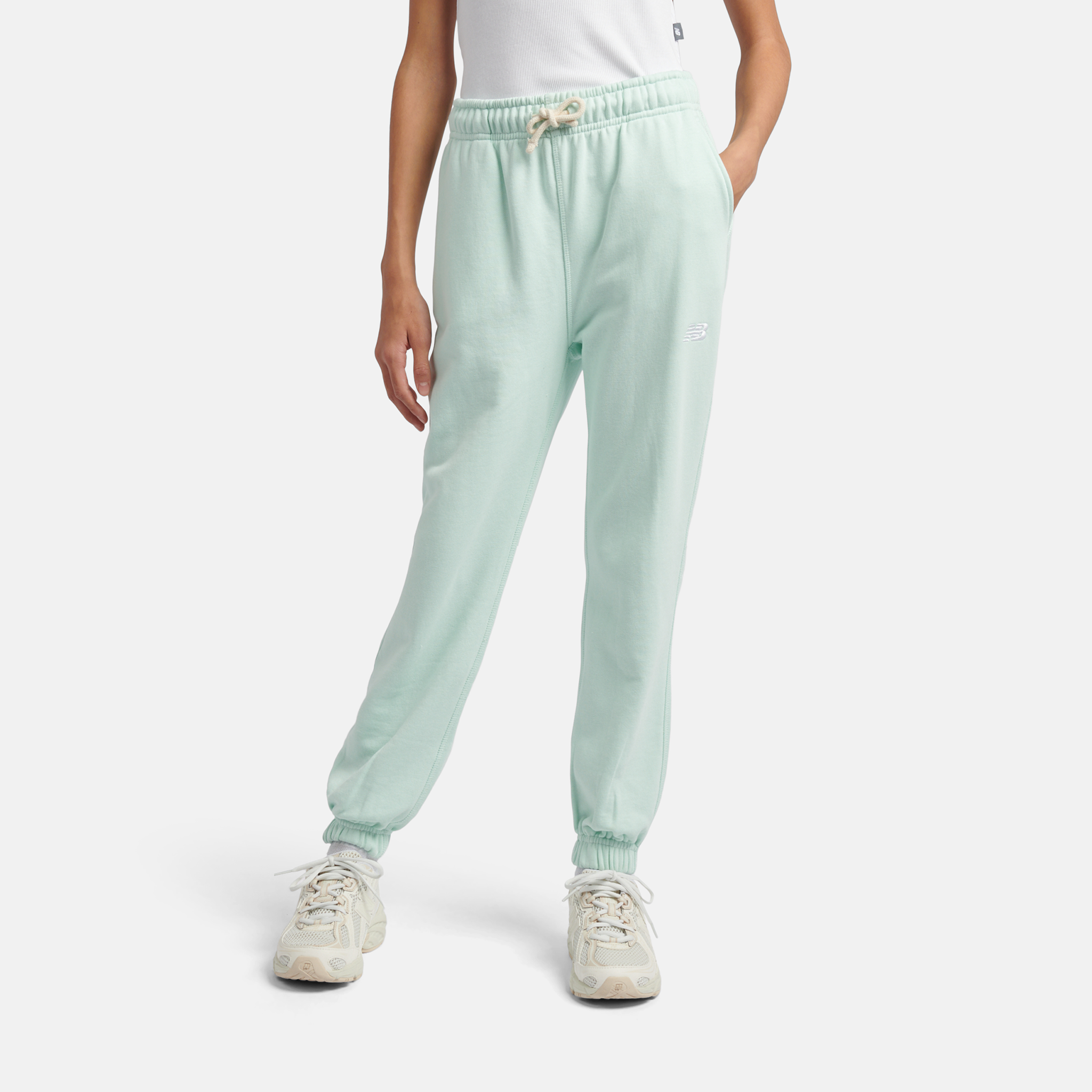 Spodnie dziecięce New Balance LAKG0058COJ – miętowe